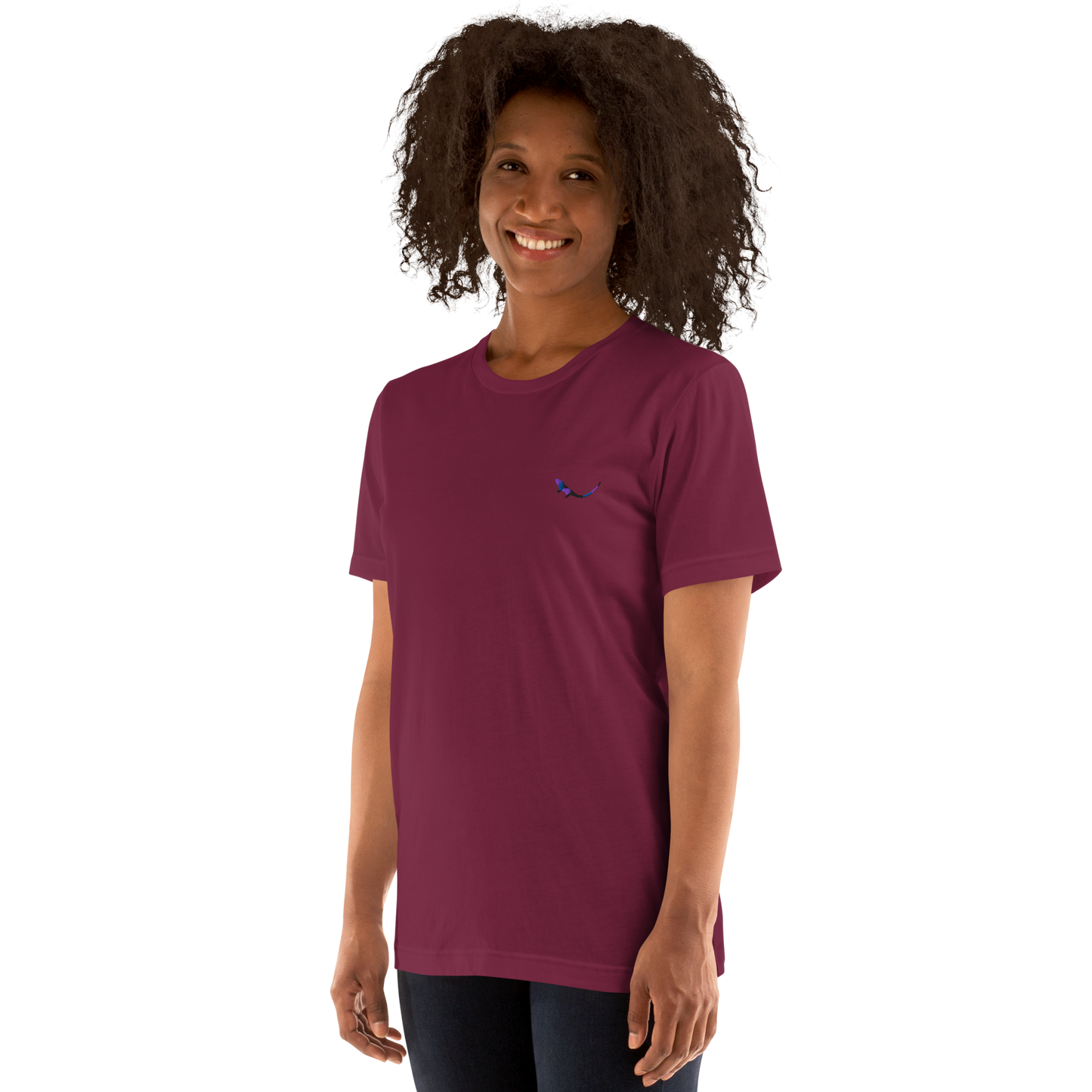 A model wearing THE SUBTROPIC Global Tee in maroon color, showcasing its original logo.