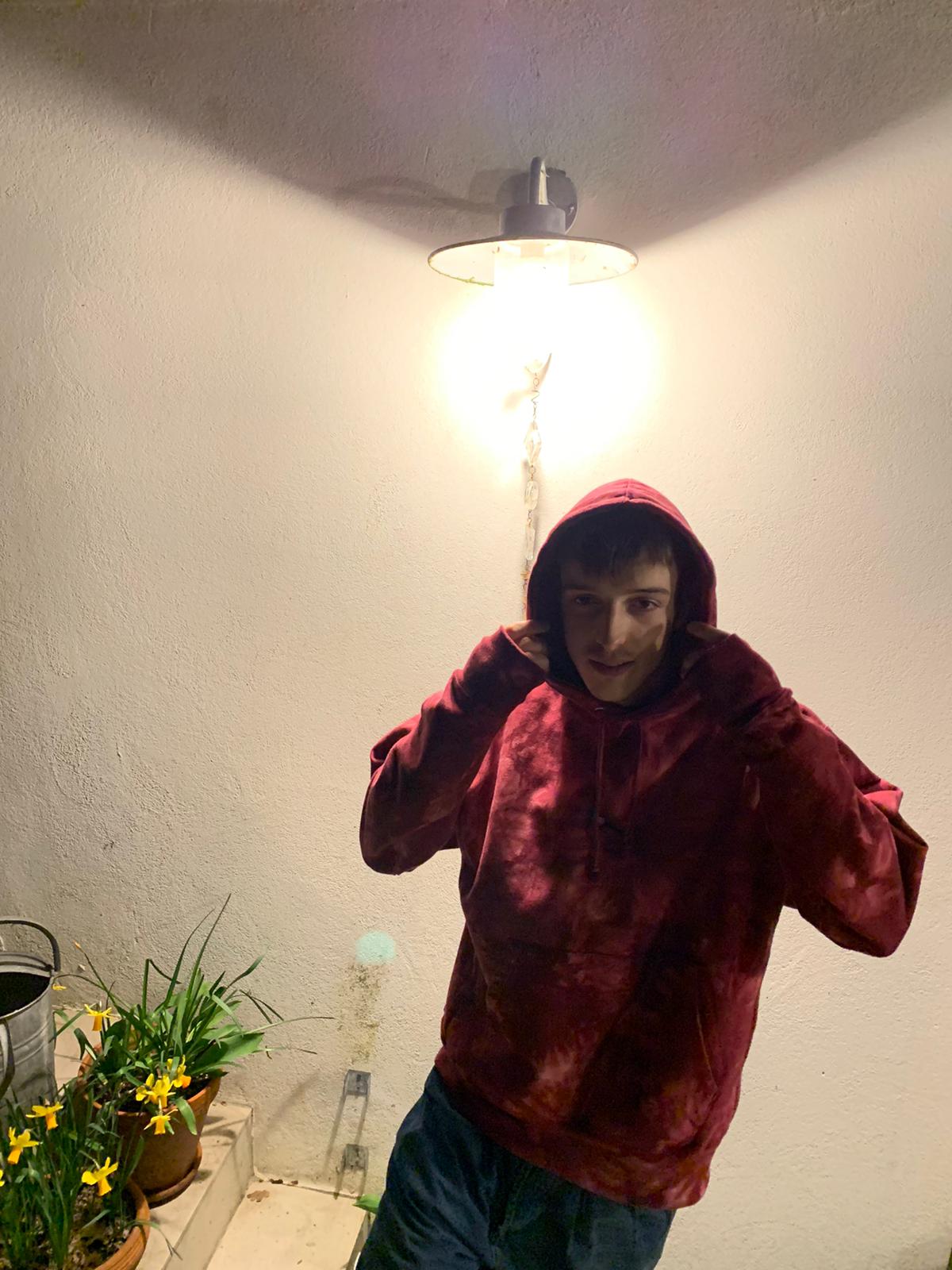 SUBTROPIC X Champion Tie-Dye Red Hoodie worn by model 6
