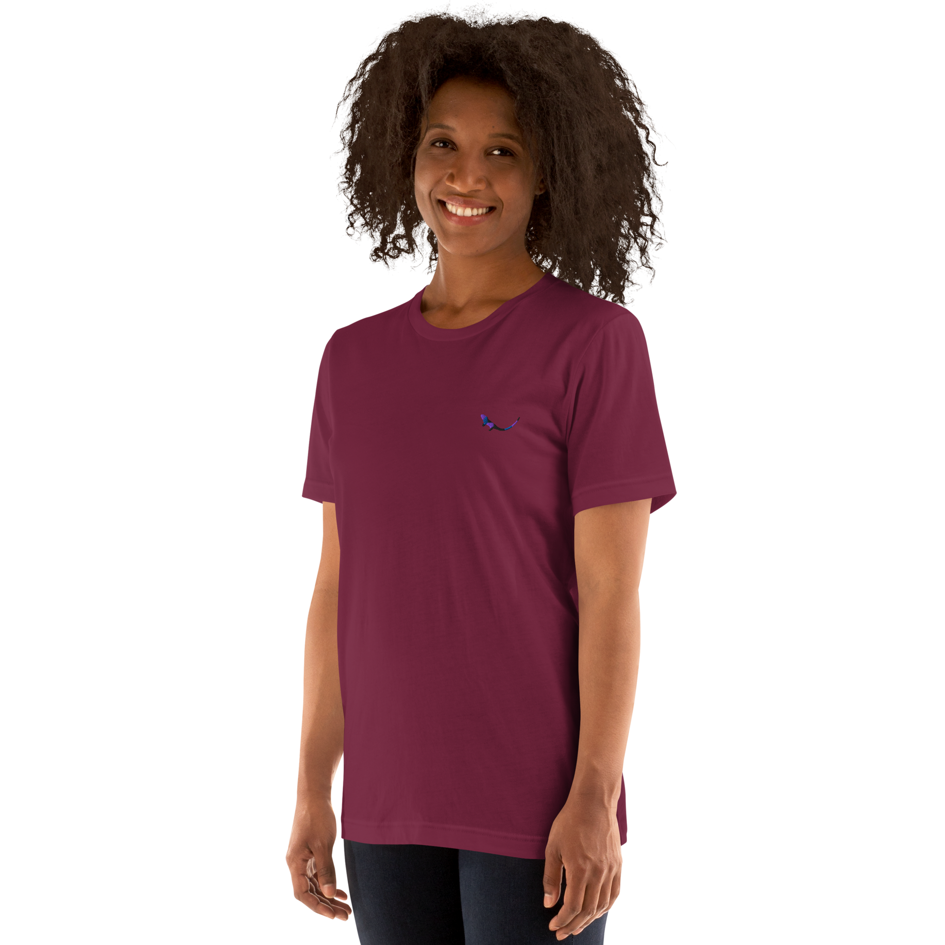 A model wearing THE SUBTROPIC Global Tee in maroon color, showcasing its original logo.