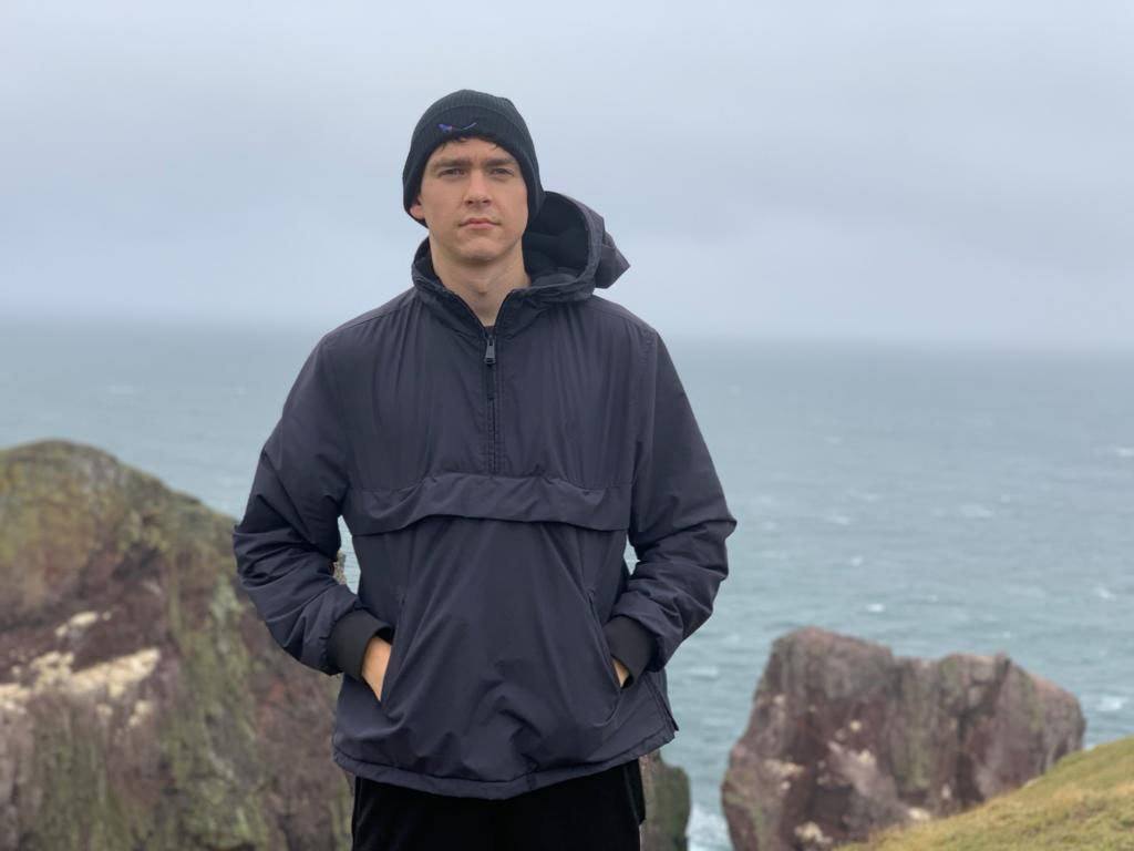 Black Organic Eco-Beanie with coastal view