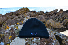 Load image into Gallery viewer, Black Organic Eco-Beanie sitting on rock
