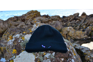 Black Organic Eco-Beanie sitting on rock