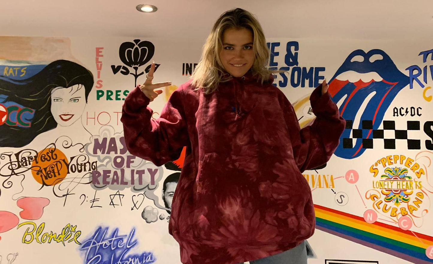 SUBTROPIC X Champion Tie-Dye Red Hoodie worn by model 1