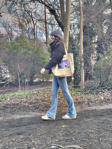 Symmetree Organic Tote Bag carried by model high pass